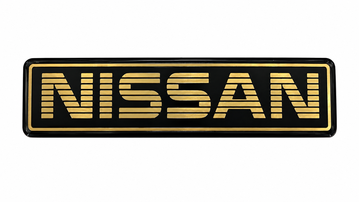 Nissan Heritage Gold & Black Flexible UV Resin Emblem – 5” x 1.25”
